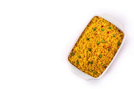 Traditional Mexican rice served with green peas isolated on white background