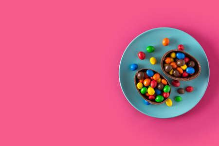 Colorful chocolate Easter eggs on pink backgroundの写真素材