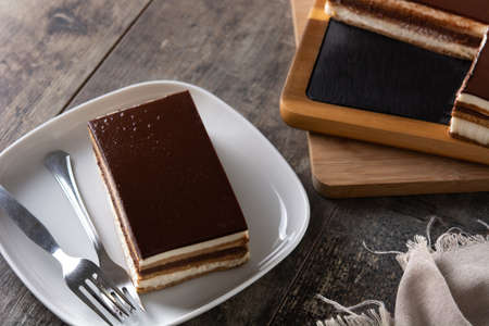 Opera cake dessert on wooden table