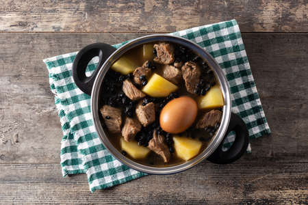 Traditional Jewish cholent on wooden tableの写真素材