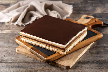 Opera cake dessert slice on wooden tableの写真素材