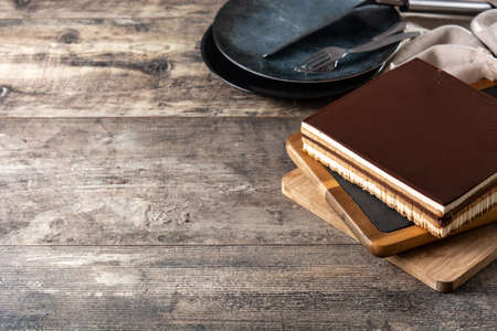Opera cake dessert slice on wooden tableの写真素材