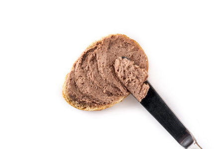 Toasted bread with pork liver pate isolated on white backgroundの写真素材