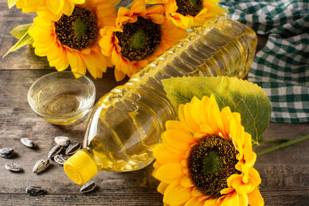 Sunflower oil plastic bottle on wooden tableの写真素材