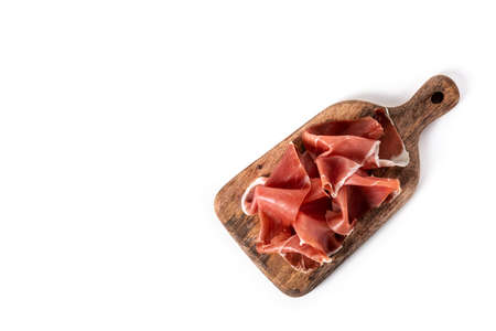 Spanish serrano ham on cutting board isolated on white backgroundの写真素材