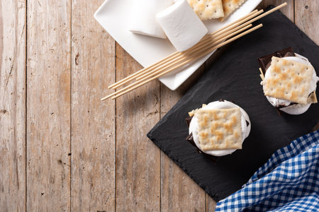 Homemade smores on wooden table. Typical American dessert