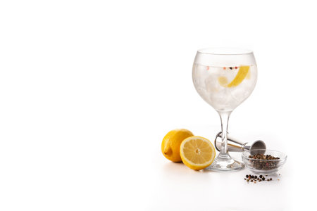 Gin tonic cocktail drink into a glass isolated on white backgroundの写真素材