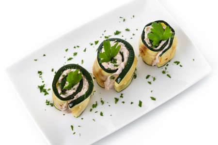 Grilled zucchini rolls with tuna and cream cheese isolated on white backgroundの写真素材
