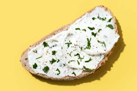 Cream cheese toast on yellow backgroundの写真素材