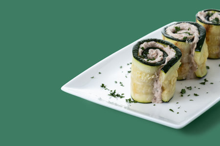 Grilled zucchini rolls stuffed with cream cheese and tunaの写真素材