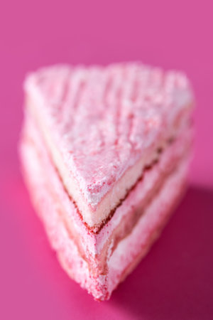 Pink strawberry cake portion on pink backgroundの写真素材
