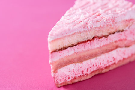 Pink strawberry cake portion on pink backgroundの写真素材