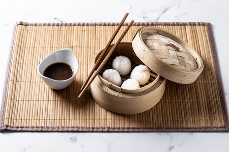 Dumplings in bamboo steamer on marble backgroundの写真素材
