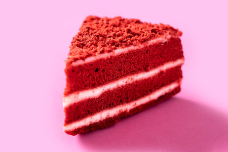 Traditional velvet cake portion on pink backgroundの写真素材