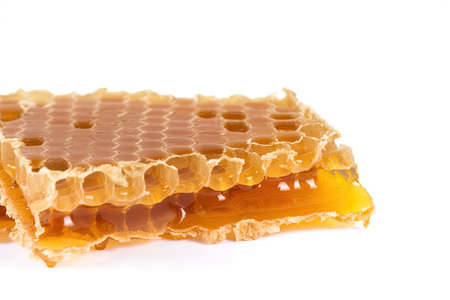 Honeycomb with honey isolated on white background.の素材