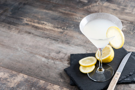 Lemon drop martini cocktail on gray stone and black backgroundの写真素材
