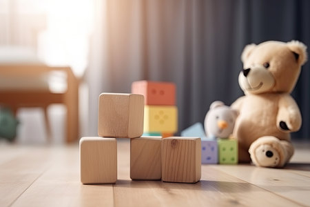 Wooden toy blocks on wooden table in the Children's room.の素材