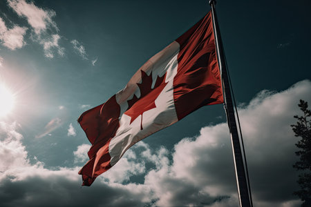 Canadian flag flying on a flag pole against a blue sky. AI generative.の素材