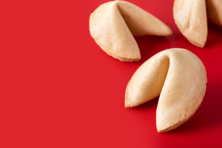 Traditional fortune cookies on red background. copy spaceの写真素材