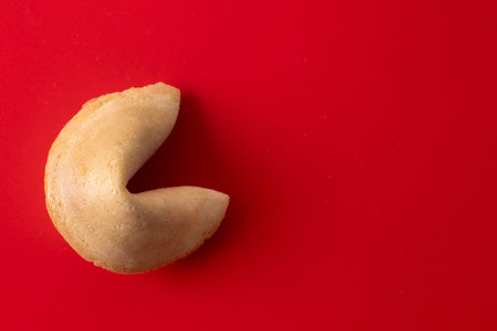Traditional fortune cookie on red backgroundの写真素材