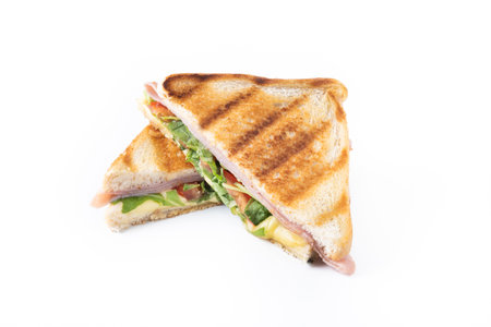 Panini sandwich with ham, cheese, tomato and arugula isolated on white backgroundの写真素材
