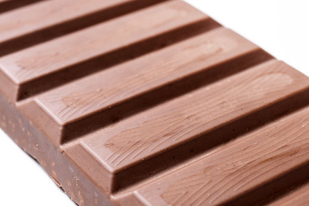 Traditional pieces of delicious Christmas chocolate nougat isolated on white background