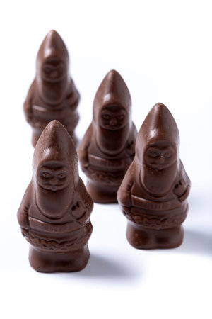 cheerful wrapped chocolate Santa Claus isolated on white backgroundの写真素材