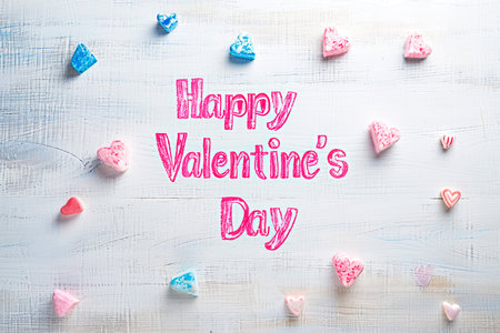 gray background with hearts with the words Happy Valentine's Dayの素材