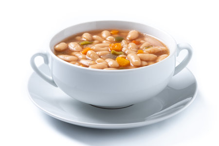 Chickpeas soup with vegetables in bowl isolated on white backgroundの写真素材