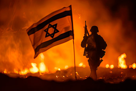 Silhouette of armed soldier against with Israel small flag on burning dark background. Concept of crisis of war and political conflicts between nations.の素材