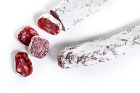 Fuet.Dry cured fuet sausage, isolated on white background.の写真素材