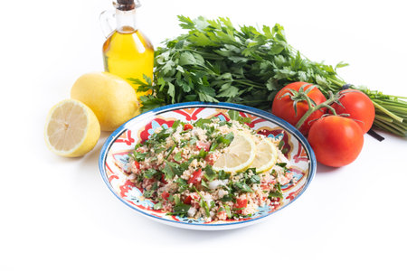 Tabbouleh salad with couscous isolated on white backgroundの写真素材