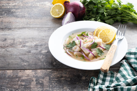 Traditional sea bass fillet on wooden table