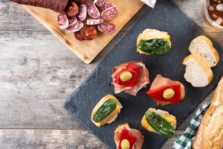 Traditional Spanish pintxos on wooden tableの写真素材