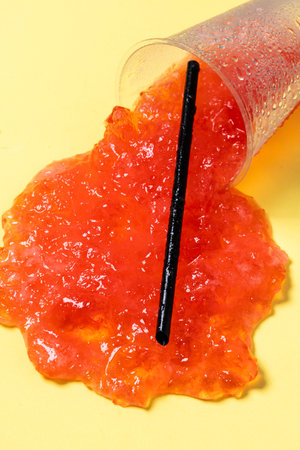 Strawberry slushie on yellow background