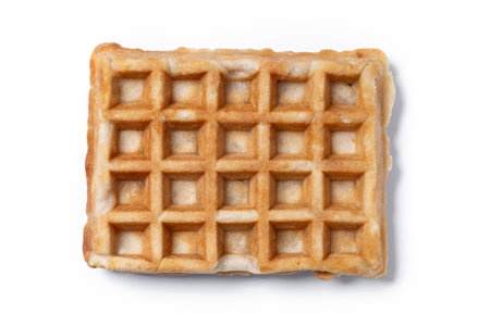 Golden Brown Belgian Waffle Isolated on White Background, Crisp Texture and Square Patternの写真素材