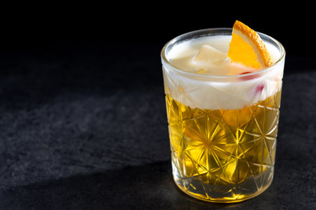 Classic cocktail whiskey sour on black background