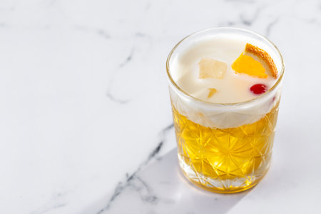 Classic cocktail whiskey sour isolated on white backgroundの写真素材
