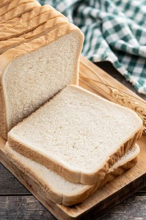 Slices of White Bread on wooden table