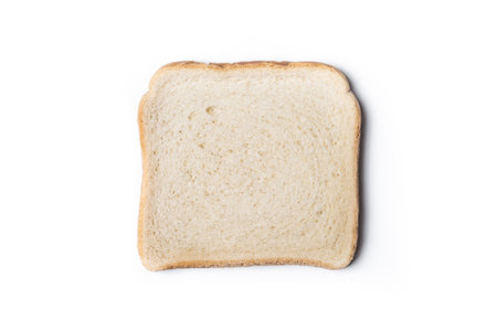 Slice of plain white bread placed on a clean white background. .の写真素材