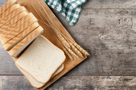 Slices of White Bread on wooden tableの写真素材