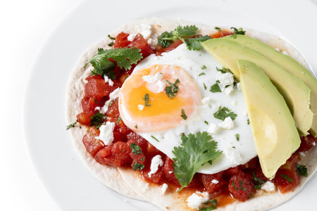 Huevos Rancheros isolated on white background. Traditional Mexican breakfastの写真素材
