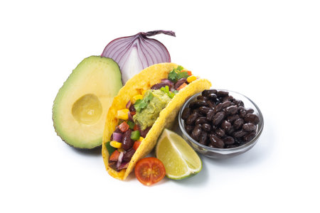 Vegan mexican Taco with beans and guacamole isolated on white backgroundの写真素材