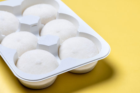 Japanese Coconut ice cream mochi on yellow background.の写真素材