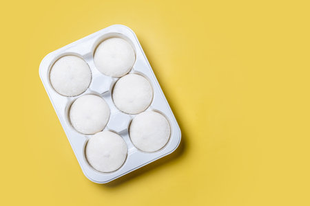 Japanese Coconut ice cream mochi on yellow background.の写真素材