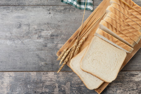 Slices of White Bread on wooden table