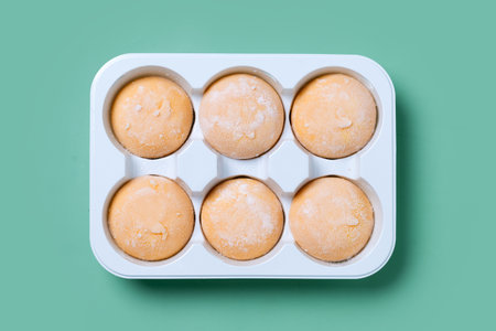 Japanese Mango ice cream mochi on green backgroundの写真素材