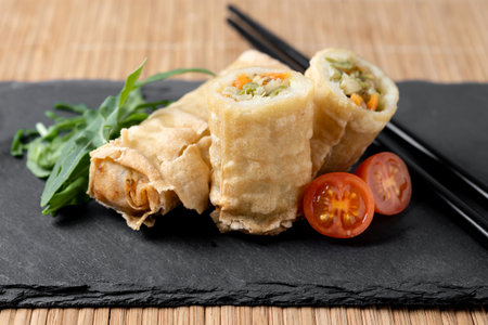 Crispy vegetables spring Rolls on wooden tableの写真素材