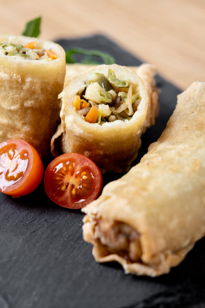 Crispy vegetables spring Rolls on wooden table