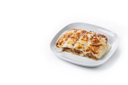 Baked Cannelloni with Cheese and BÃ©chamel Sauce isolated on white backgroundの写真素材